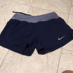 Blue nike running shorts.